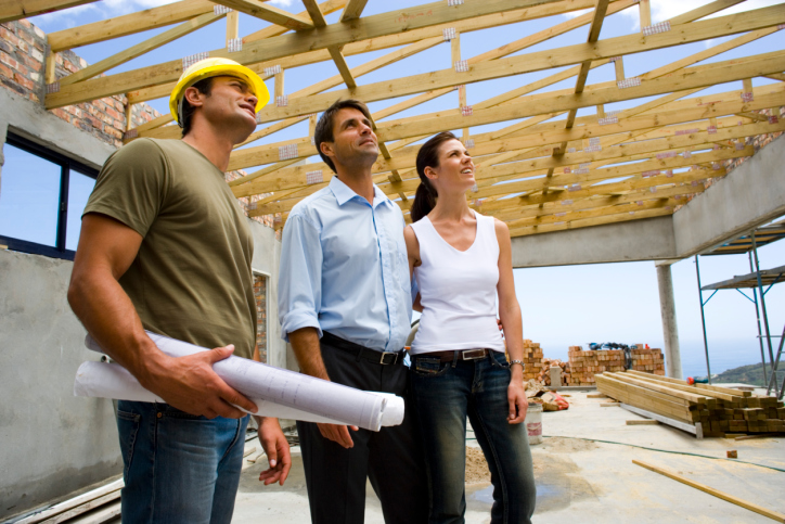 Couple with contractor in structure